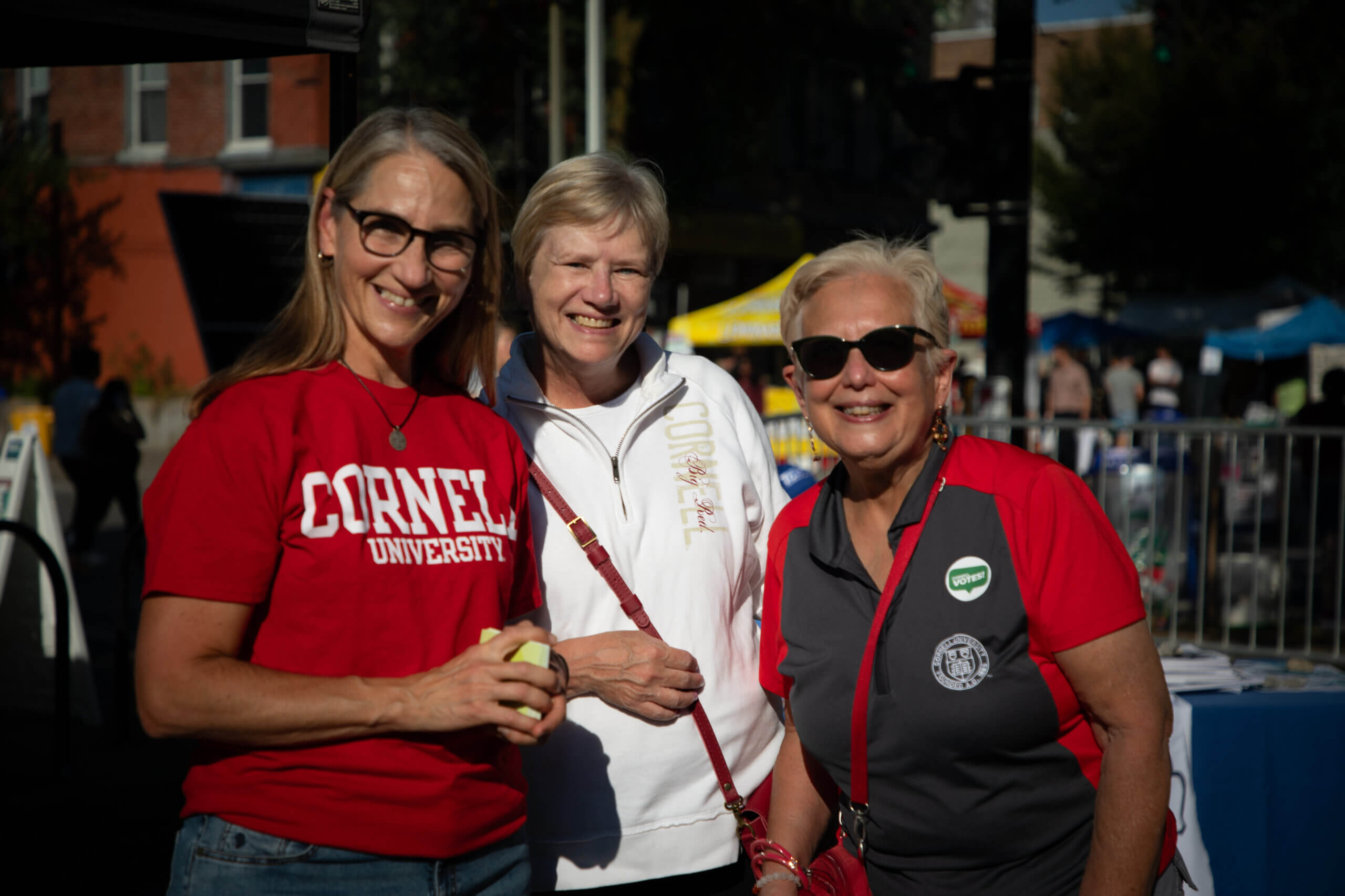 Downtown Ithaca event attendees smiling outdoors