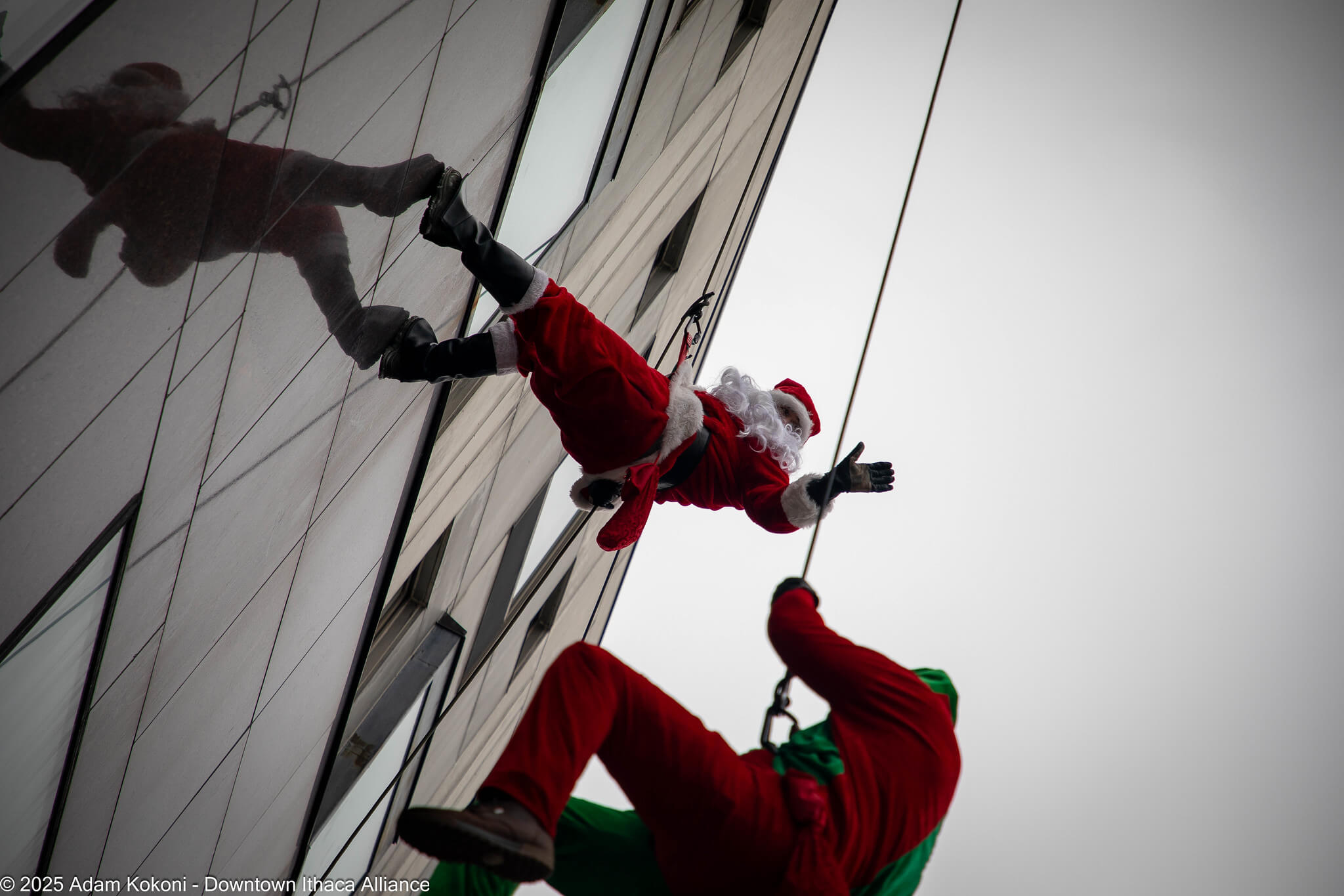 Downtown Ithaca aerial performer on a building wall