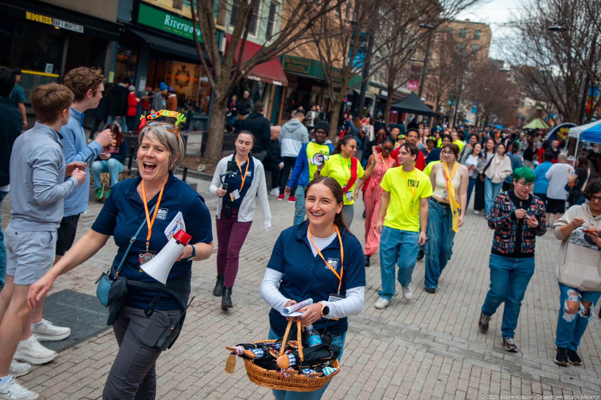Downtown Ithaca event crowd moving through the Commons