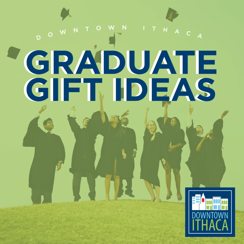 People in dark colored graduation gowns tossing their caps in the air